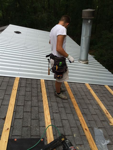 putting a metal roof over shingles